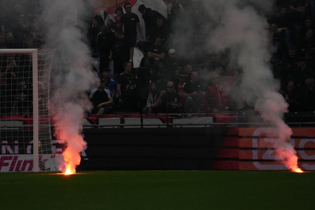 Ajax vs Feyenoord match abandoned due to fan flares  
