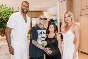 Tristan Thompson poses with Kourtney & Khloe Kardashian  