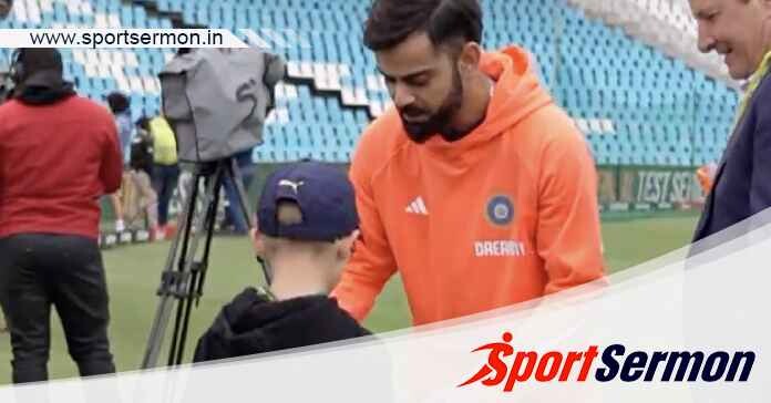 Cricketer Virat Kohli signs a young fan's RCB jersey!  