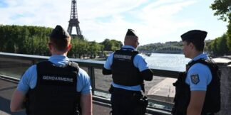 Unidentified Man Tries Climbing Eiffel Tower During Olympics Closing Ceremony  