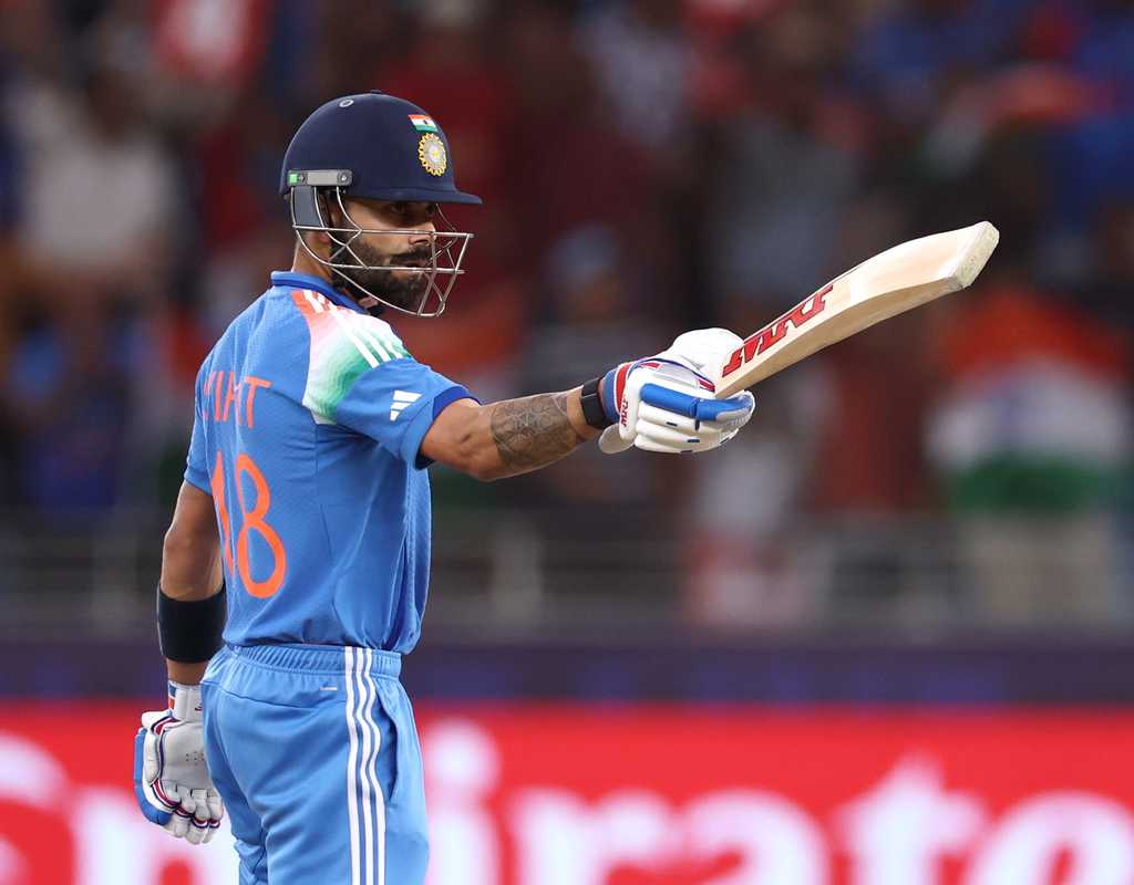 Kohli guides India to third successive Champions Trophy final  