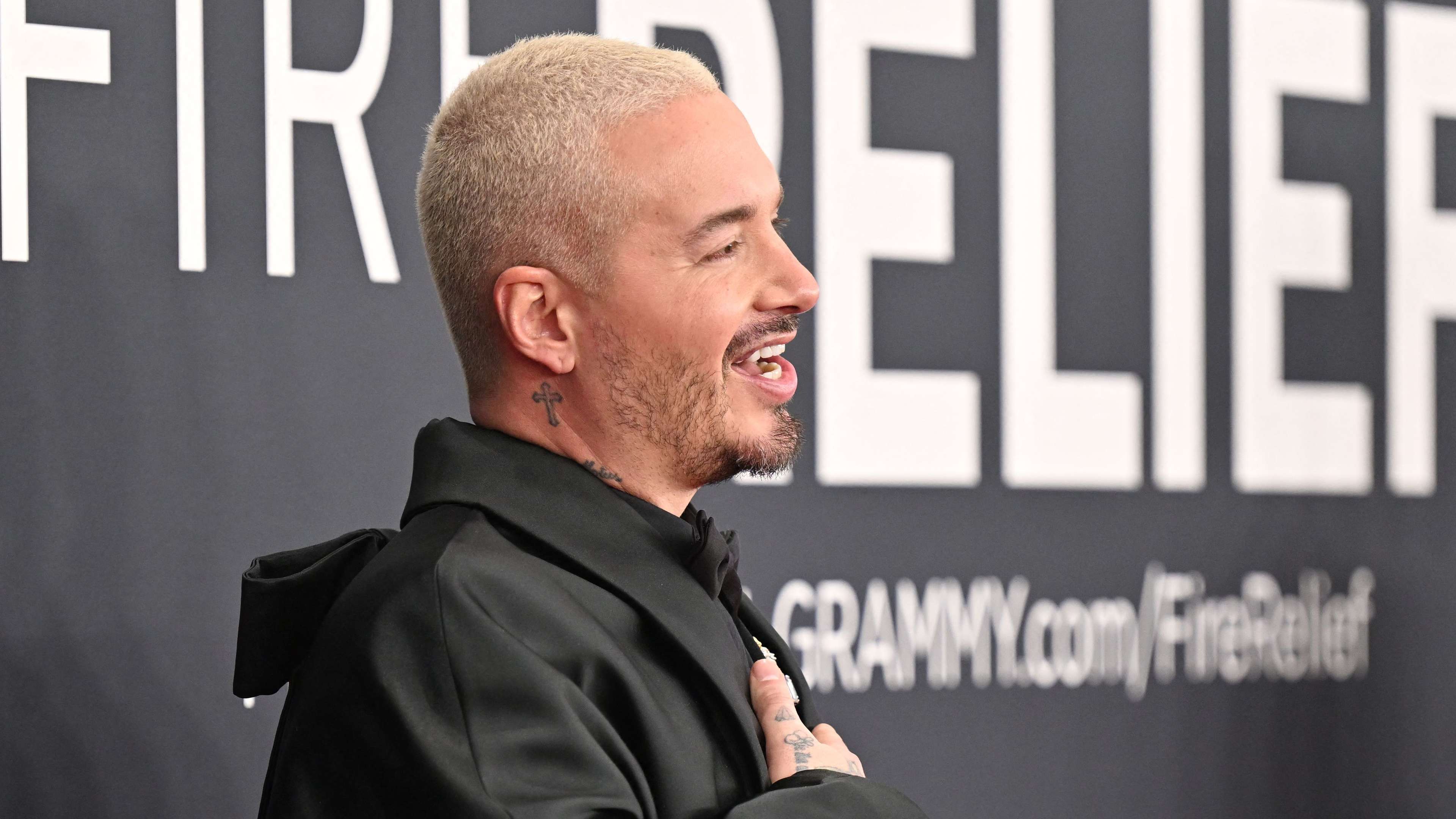 J Balvin poses with San Diego FC's McVey, Angel, and Sisniega  